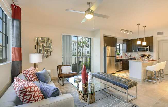 Living room with a ceiling fan at Palm Ranch Apartments in Davie, FL