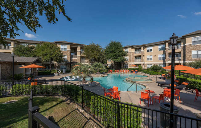 Swimming pool area at Woodbridge Villas Apartments, Sachse, TX