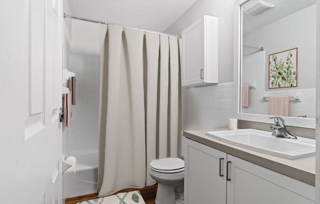 Brightly lit bathroom at Rosemont Square Apartments, Massachusetts, 02368