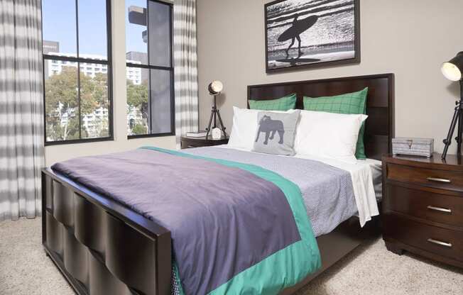 Apartments for Rent in Mission Valley - Spacious Bedroom with Two Windows, Plush Carpet, and Modern Furnishings.