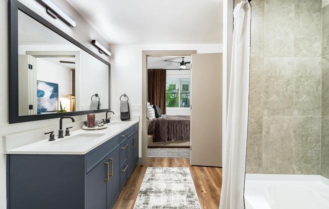 Designer bathrooms feature quartz countertops, modern cabinetry, and spacious layouts with elevated finishes throughout.