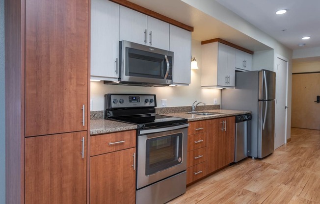 The Morgan | #404 Kitchen with beautiful cabinetry and stainless steel appliances