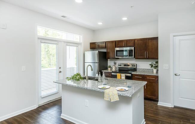 a kitchen with an island in the middle of a room