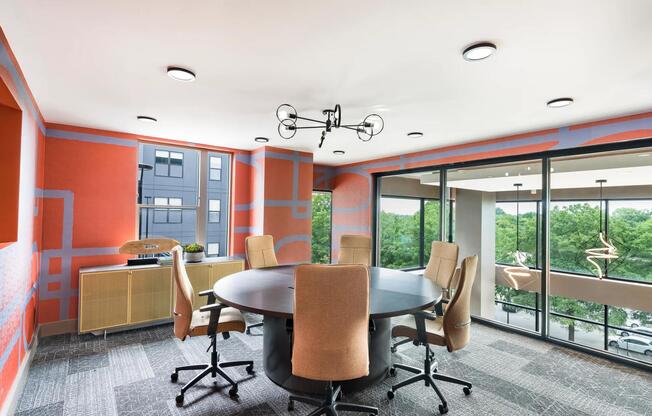 Vibrant conference space with floor-to-ceiling windows, perfect for meetings, brainstorming, or remote collaboration at Modera LoSo.