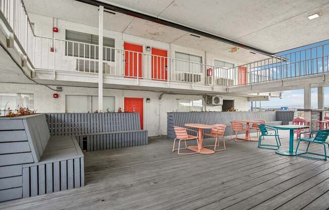 A patio area with a table and chairs.