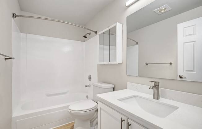 a bathroom with a sink toilet and a shower at 2000 Lake Washington Apartments, Washington