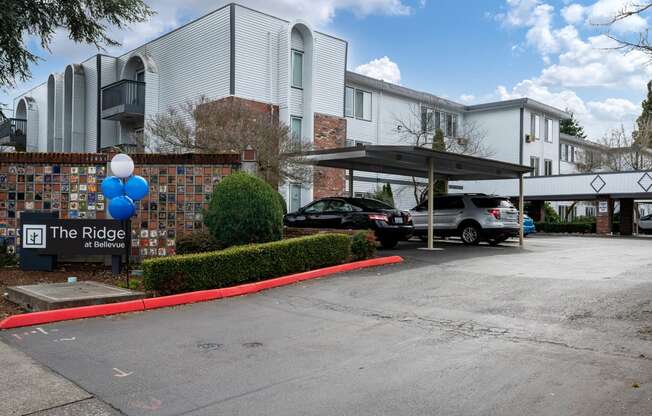 the ridge condominiums building entrance and parking lot