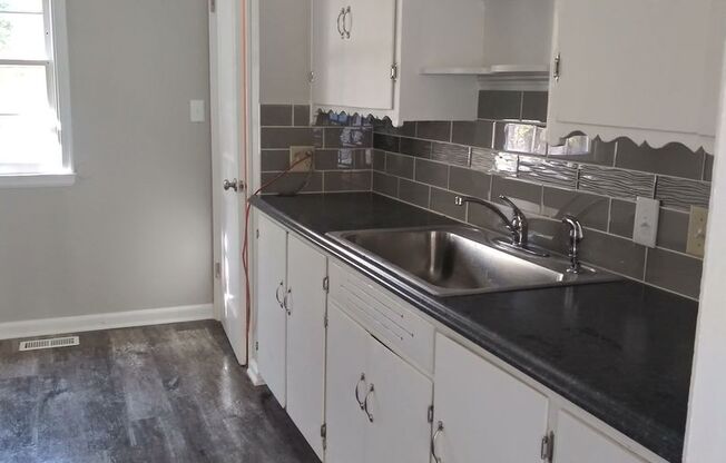 3br 1.5 bath, NEWLY RENOVATED! Garage, fenced back yard, plank flooring