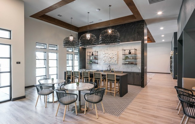 Discover the heart of community living at Modera Georgetown's expansive clubroom, complete with a cozy coffee bar and inviting gathering spaces