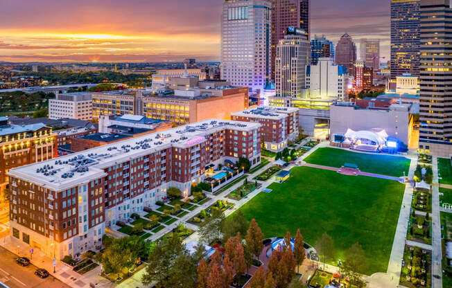 an aerial view of the city at sunset