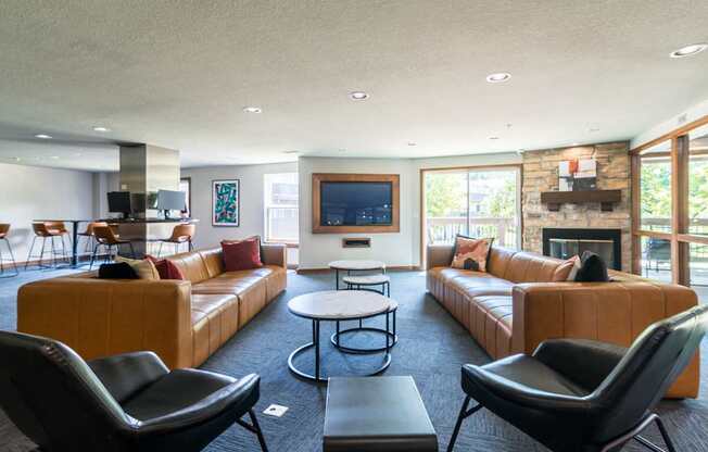 A living room with a fireplace and a flat screen TV.