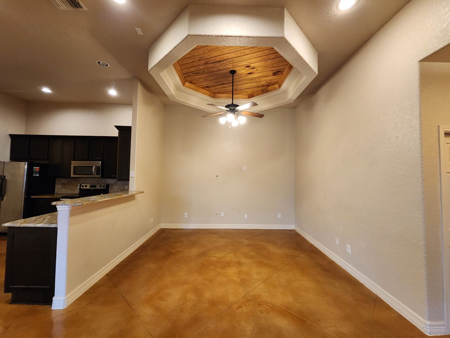 Stained Concrete Floors / Side by Side Fridge Included / Covered Patio / Fenced in Yard / CISD