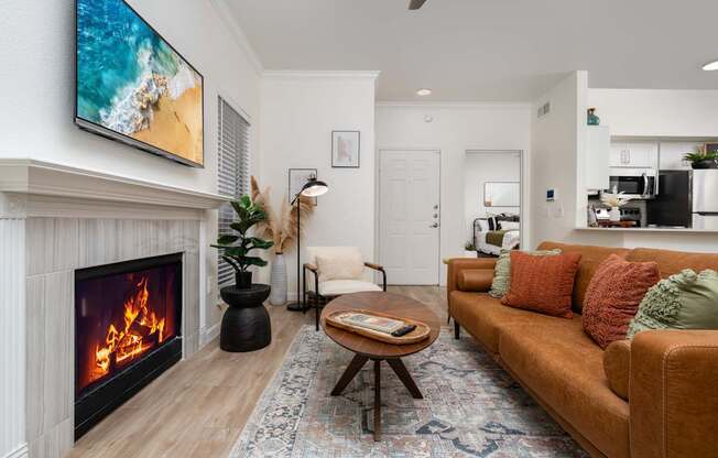 A living room with a fireplace and a couch.