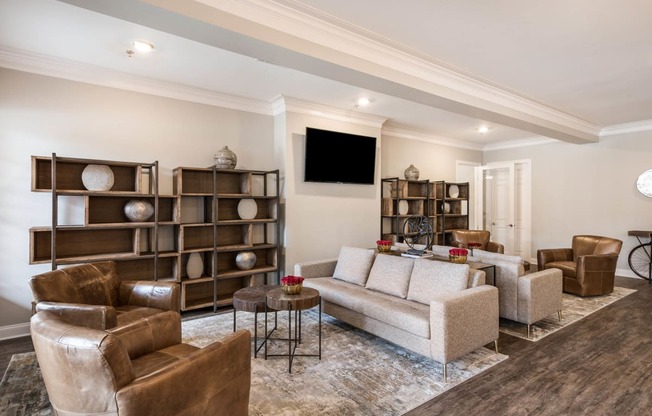 a living room with couches and chairs and a tv at Arlo Luxury homes Apartments, Little Rock, Arkansas