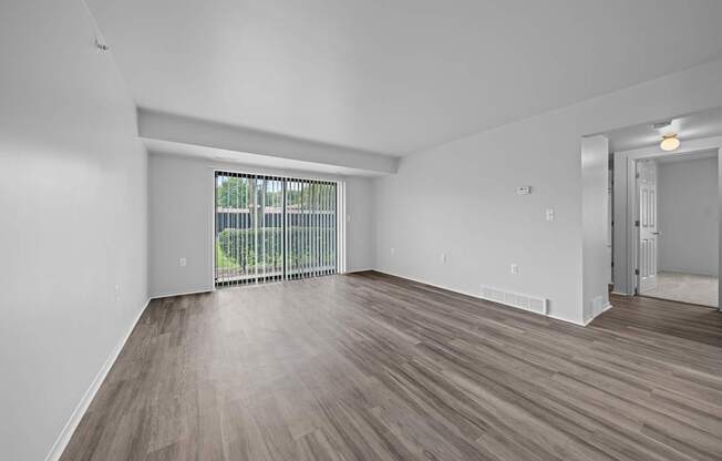 Spacious living room with natural light at Westwood Village Apartments in Westland, MI