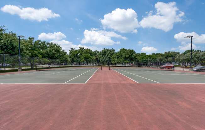 the tennis courts are clean and ready for players to play