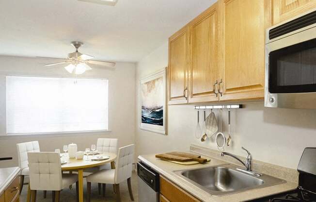 galley kitchen with dining tables and chairs at Heatherwood House at Ronkonkoma, Lake Ronkonkoma, NY, 11779