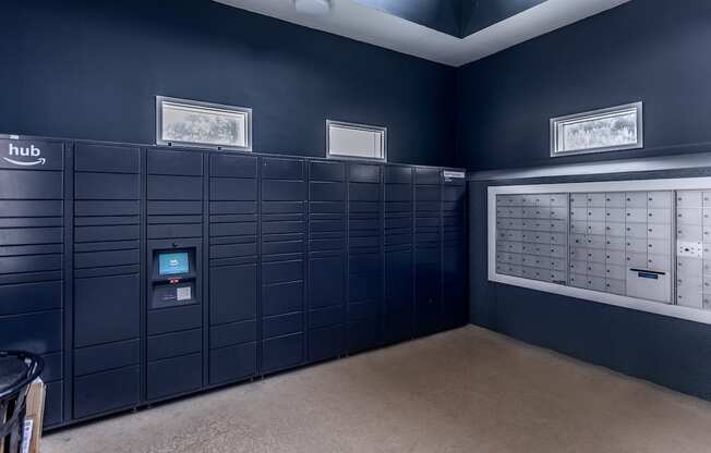 a row of lockers in a blue room with pictures on the wall