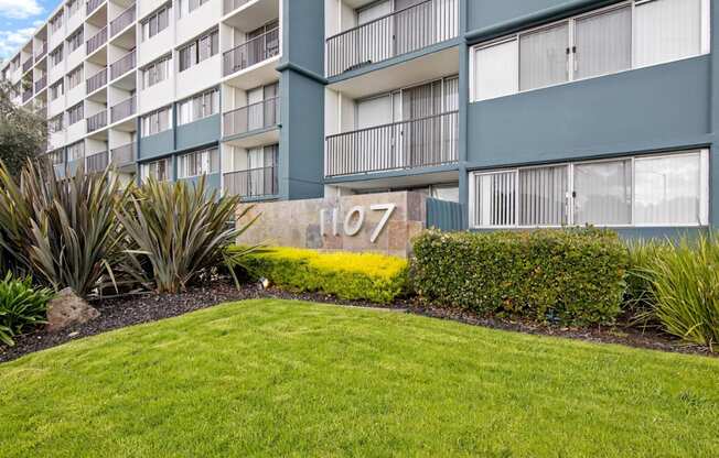 exterior of avenue two apartment building with green lawn at Avenue Two Apartments, California, 94063