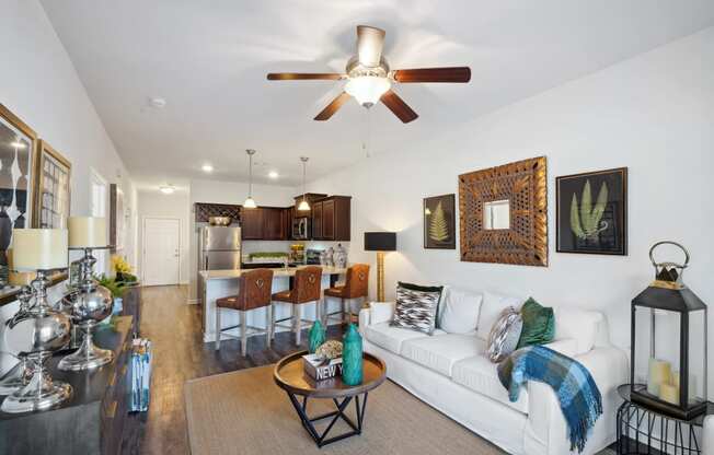 Living room with a white couch and a ceiling fan  at The Meadows, Bloomingdale, Georgia