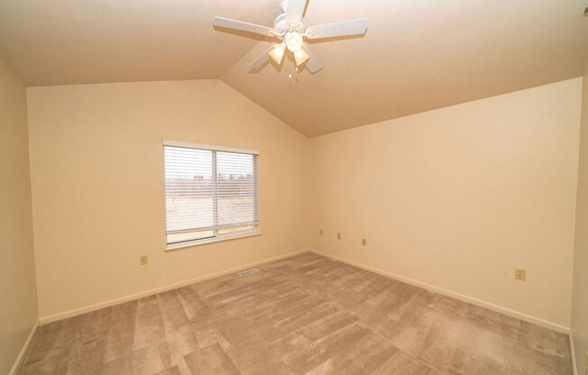 Bedroom with a Ceiling Fan at Foxwood and The Hermitage, Portage, MI