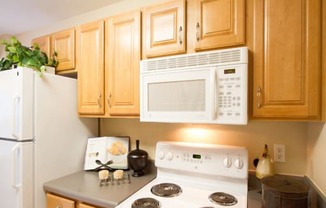 Large kitchen with plenty of food storage options at The Summit at Owings Mills Apartments, Maryland