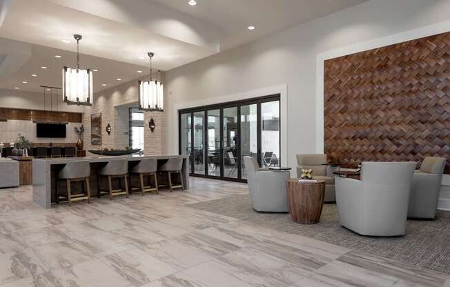 A modern living room with a bar area and a dining table.