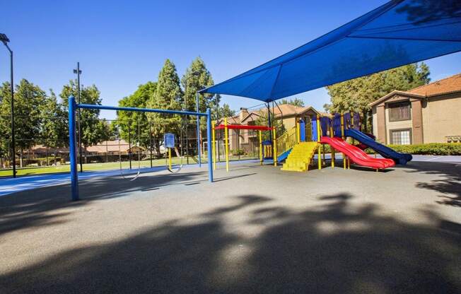 a playground with slides and swings  at Citrine Hills, Ontario, CA