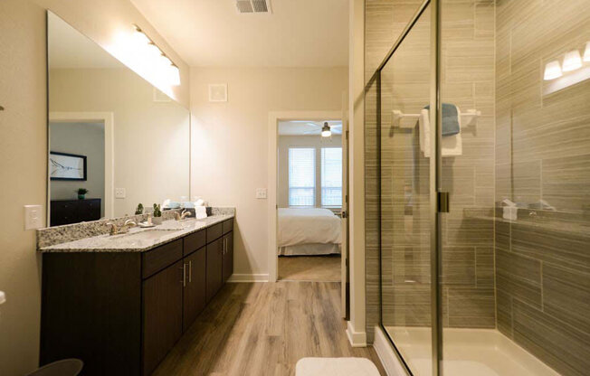 a bathroom with a shower sink and toilet at Luxor Club, Jacksonville