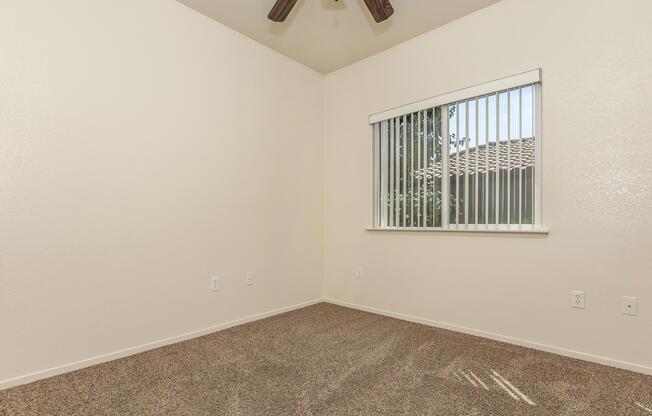 a bedroom with a bed and a mirror