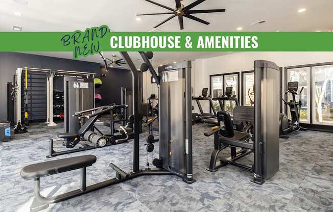 A gym with a green sign that says "Brand New Clubhouse & Amenities".