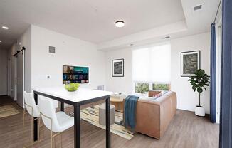a living room with a table and a couch