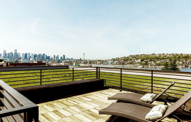 a deck with a view of the city and the water