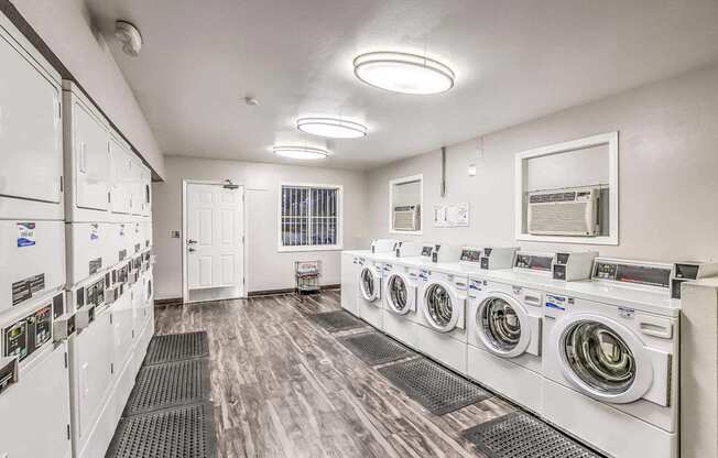 A row of washing machines in a laundromat.