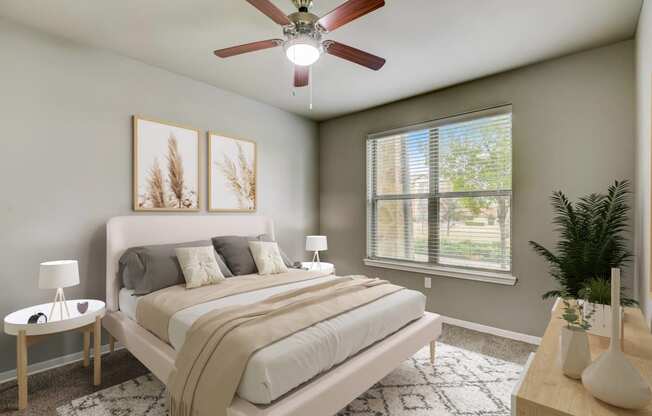 an empty bedroom with a ceiling fan and a bed