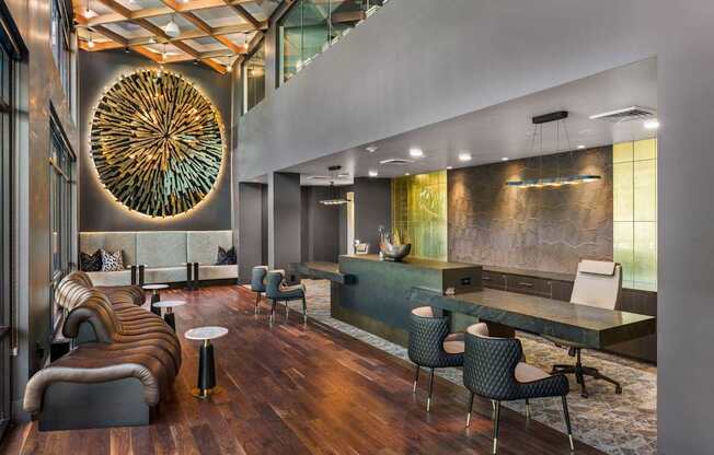 A modern living room with a large circular artwork on the wall.