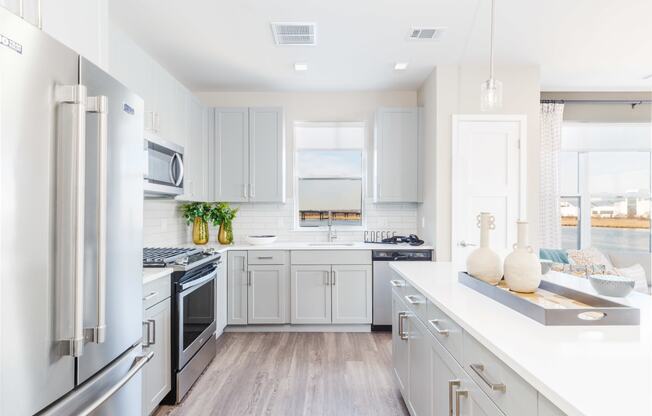 Modern Kitchen Including Quartz Countertops, Designer Tile Backsplashes & Stainless Steel Appliances including Gas Range