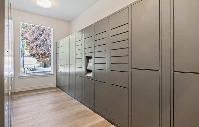 the walk in closet has plenty of storage and a window