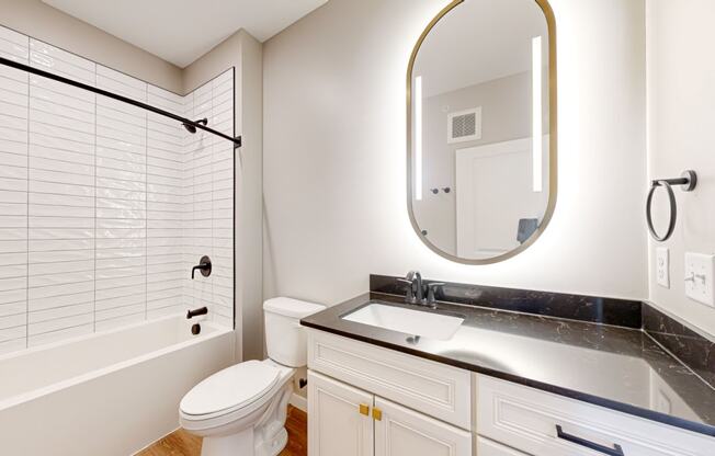 a bathroom with a sink toilet and a shower