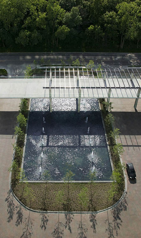 A car is parked on the right side of the image.