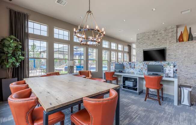 a conference room with a large table and chairs and a fireplace