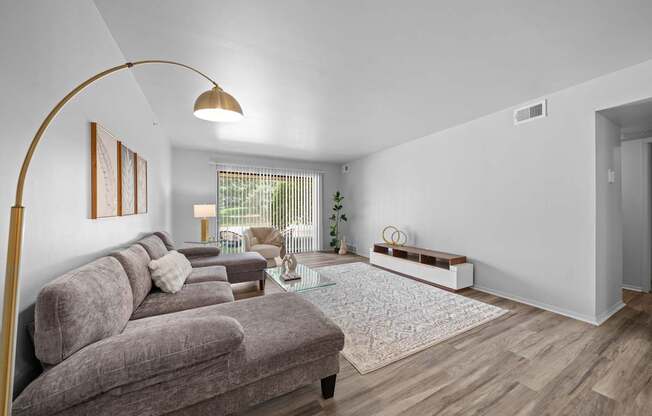 Living room with patio at Dover Hills Apartments in Kalamazoo