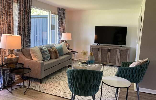 a living room with a couch and a tv