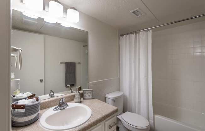 This is a photo of the bathroom in the 871 square foot 2 bedroom, 2 bath apartment at Princeton Court Apartments in the Vickery Meadow neighborhood of Dallas, Texas.