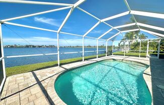 Beautiful Waterfront 3 Bed 2 Bath Home With Heated Pool, Washer/Dryer In Unit & More!