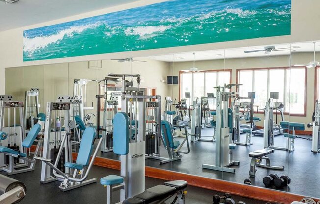 interior fitness center with resistance machines and free weights