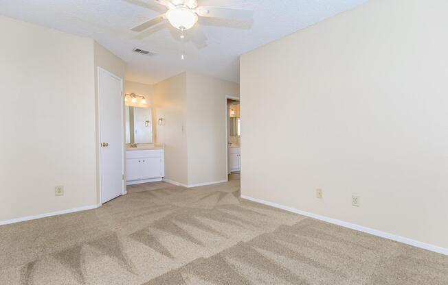 a bedroom with a large mirror