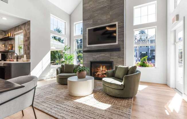A living room with a fireplace and a television above it.