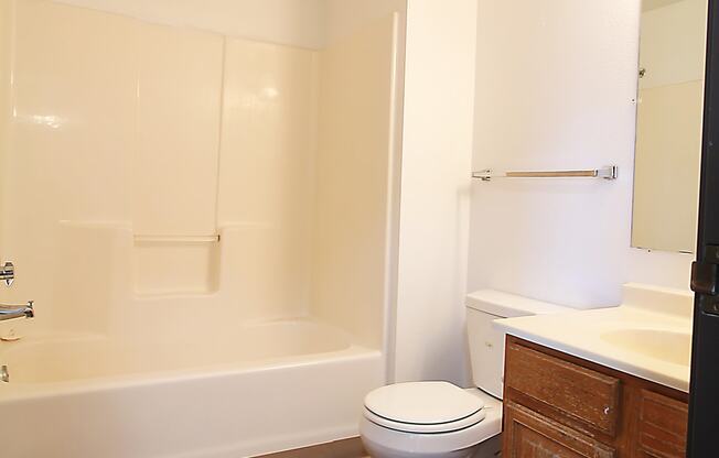 a bathroom with a toilet sink and bathtub