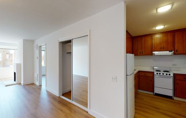 a kitchen and living room in an apartment